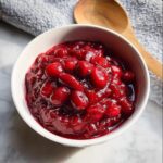 A bowl of glistening, homemade cranberry sauce, a perfect Thanksgiving side dish.